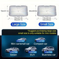Open foldable car windshield sunshade umbrella placed against a car windscreen.