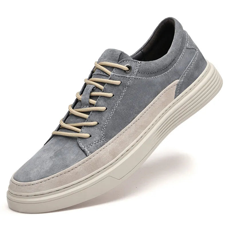 Men's grey casual leather skate shoes with a round toe and front lace-up on a soft rubber sole.