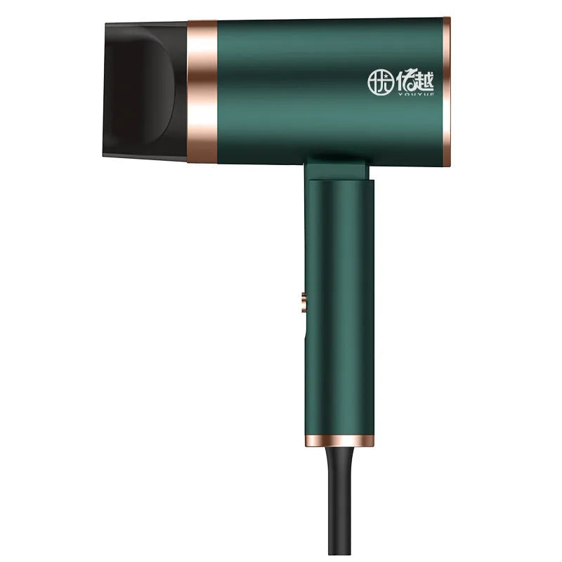 Foldable negative ion hair dryer in emerald green with nozzle attached