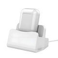 White headphone charging base with fashionable last design on wooden surface