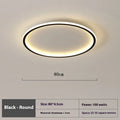 Modern circular minimalist LED ceiling lamp in black finish, shown mounted on a white ceiling.