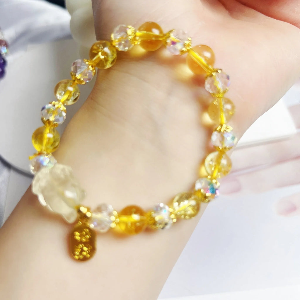 Handmade adjustable bracelet with a natural citrine nine-tail fox charm on a silver-tone chain.