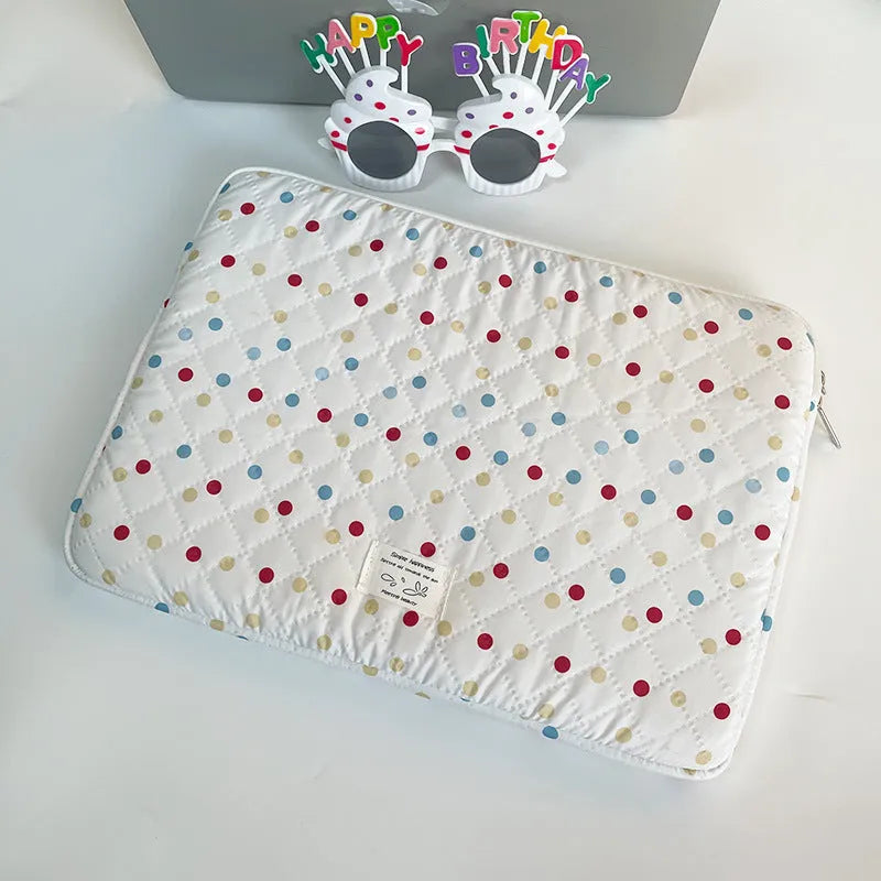 Polka dot patterned polyester laptop bag for women, shown in a solid colour with size options for 11, 13/14, and 15/15.6 inch laptops.
