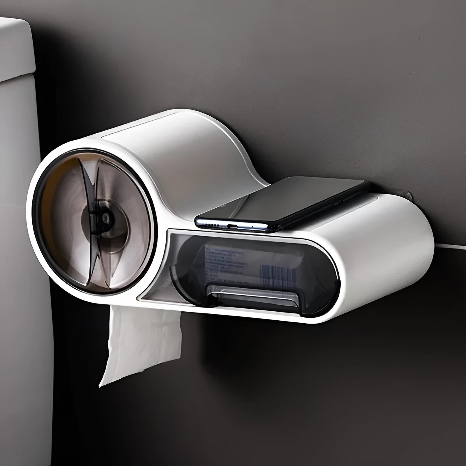 White plastic bathroom roll holder with a streamline curve design on a bathroom surface.