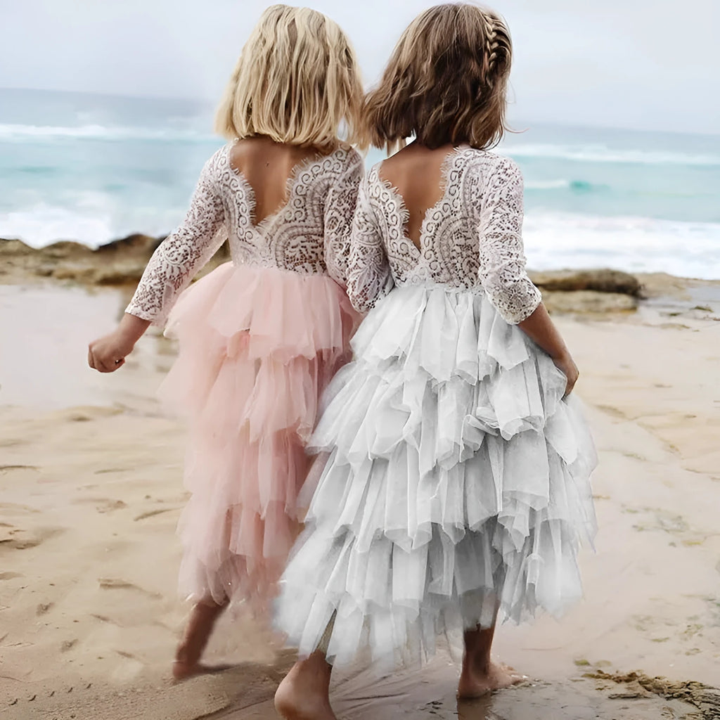 White long-sleeved lace princess dress for girls with an irregular hemline, shown on a hanger.