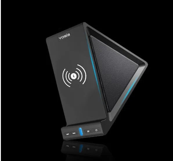 Black Bluetooth speaker with built-in stand holding a mobile phone on a desk.
