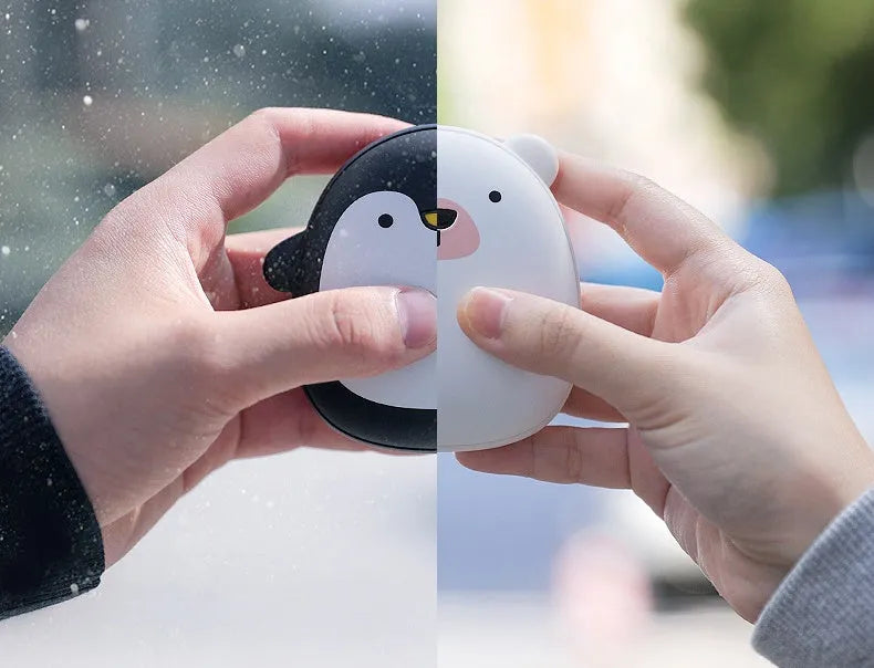 Cartoon penguin and polar bear USB rechargeable electric hand warmers showing dual-sided heating design