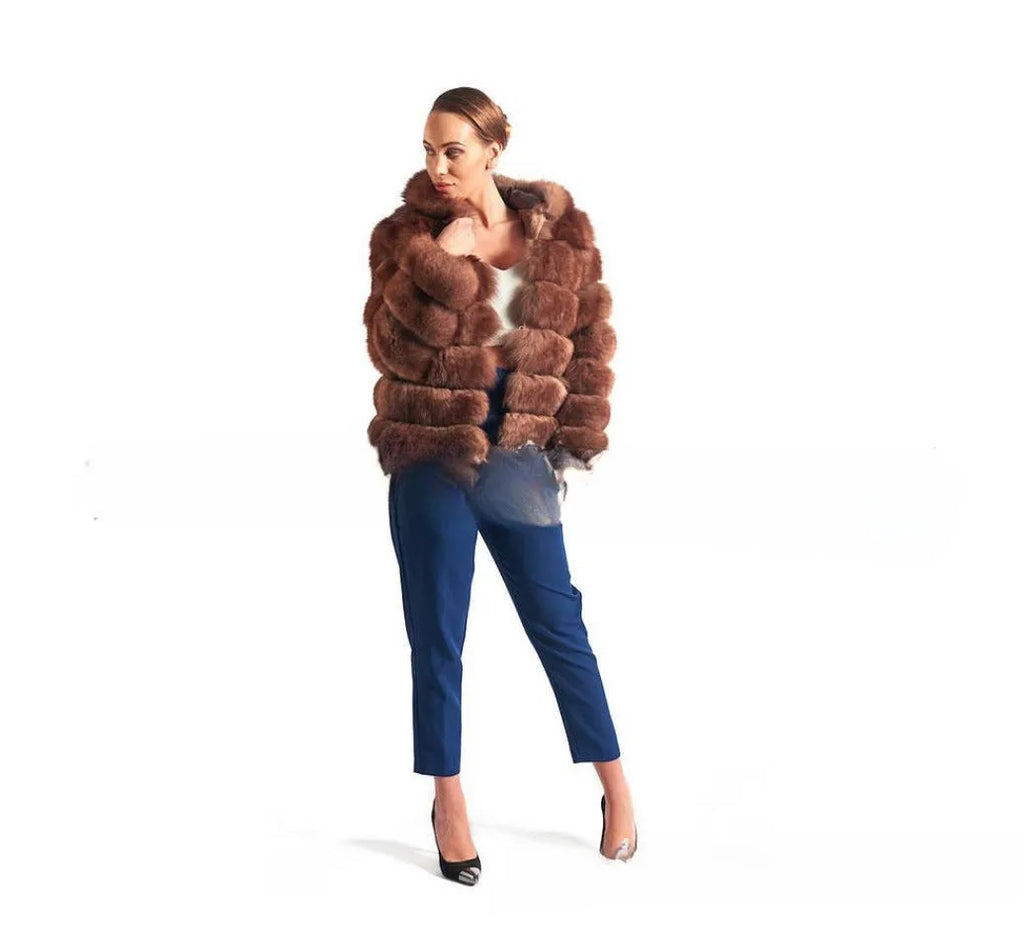 Loose-fitting women's faux fur coat with a hood in brown, shown in streetwear style.