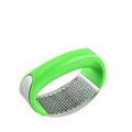 Stainless steel garlic press with non-slip handle in available colours crushing garlic