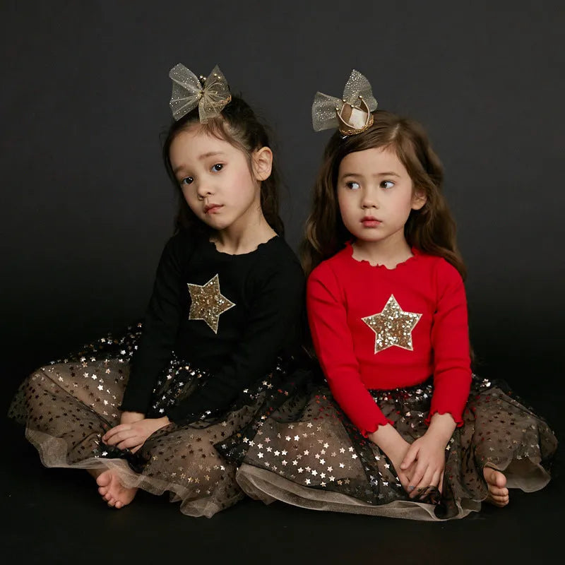 Girls red Christmas dress with long sleeves, princess skirt, and embroidered star details