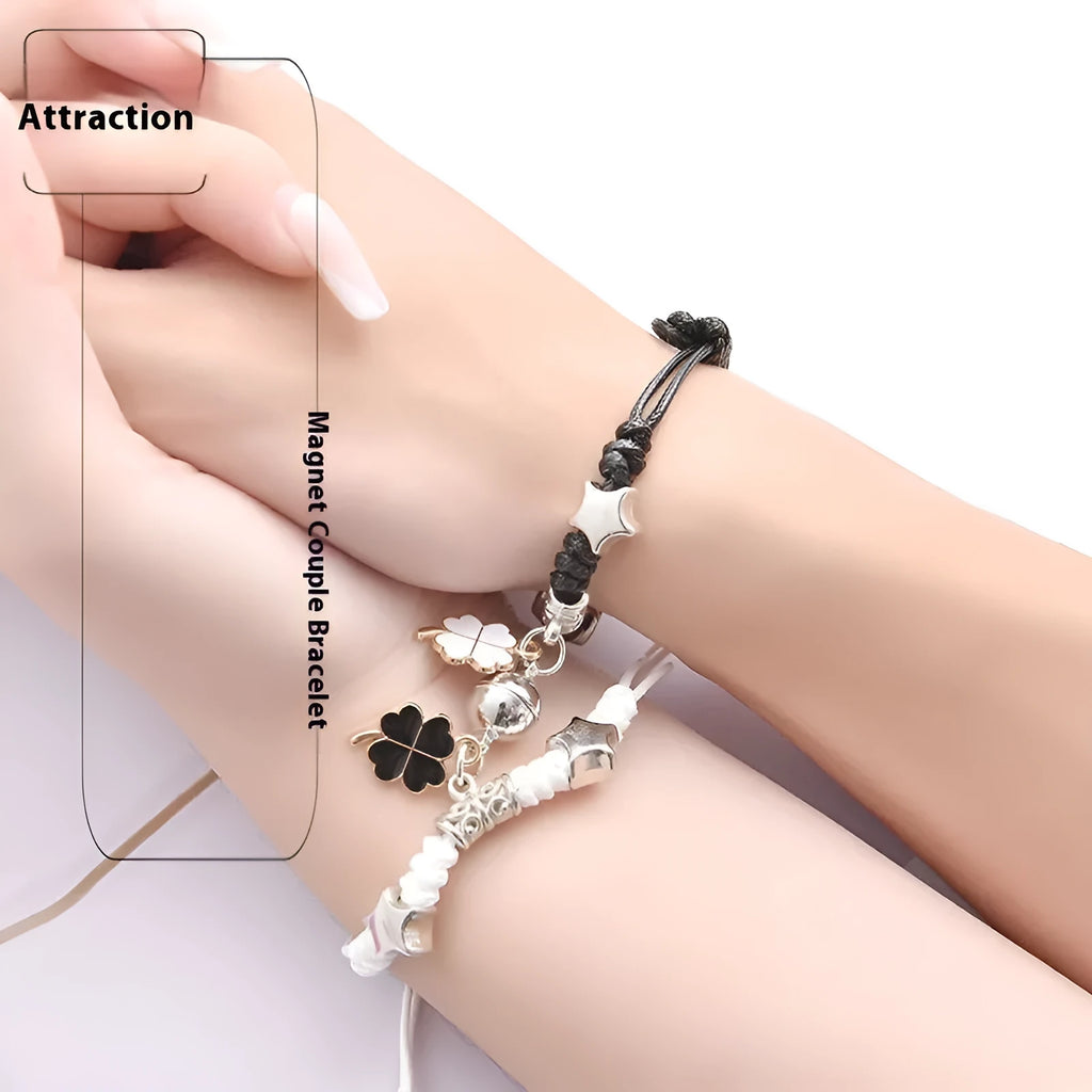 A pair of magnetic couple bracelets with alloy charms showing an I love you design and a key lock on a textured background.