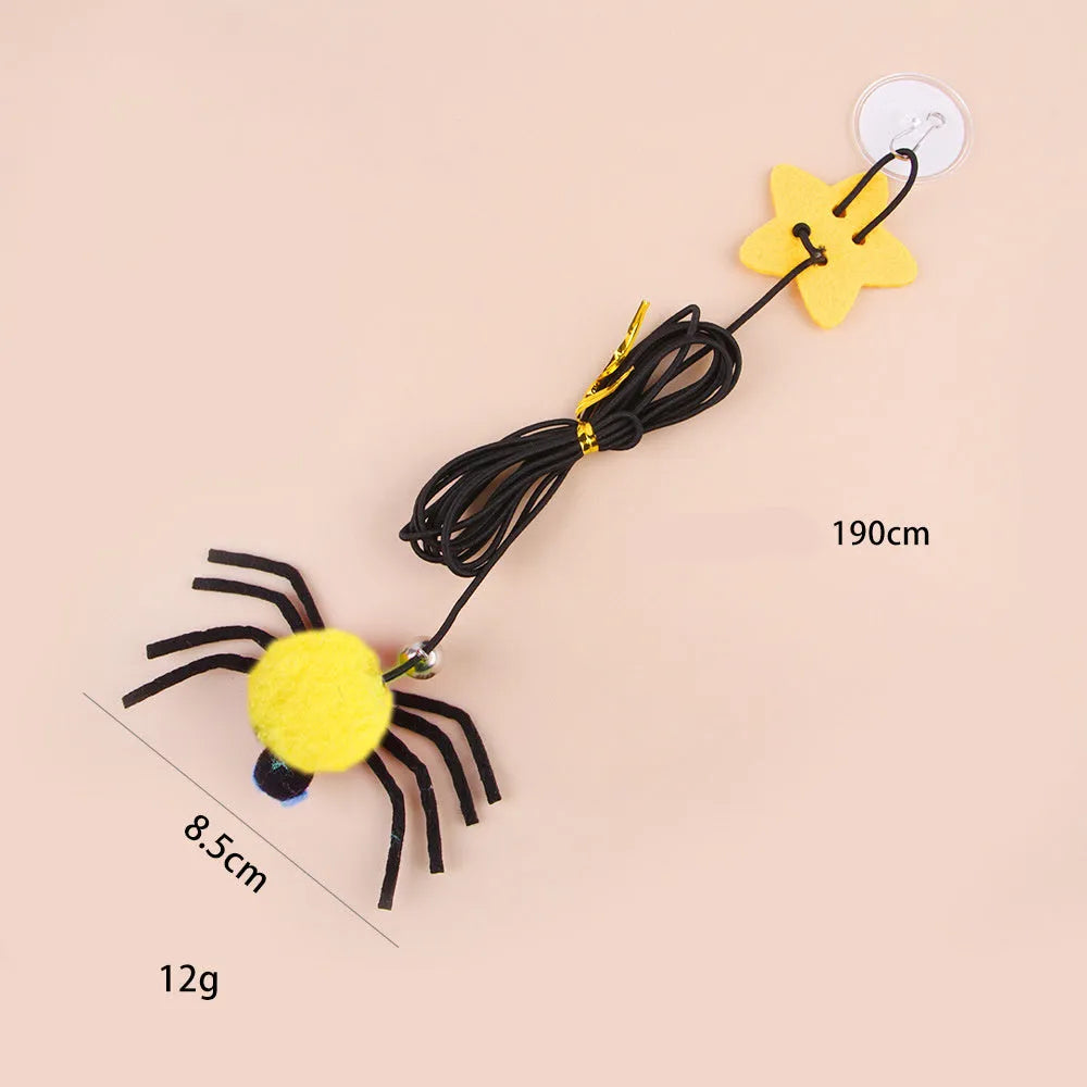 Red hanging door cat toy with elastic rope, feather, bell, and spider attachment