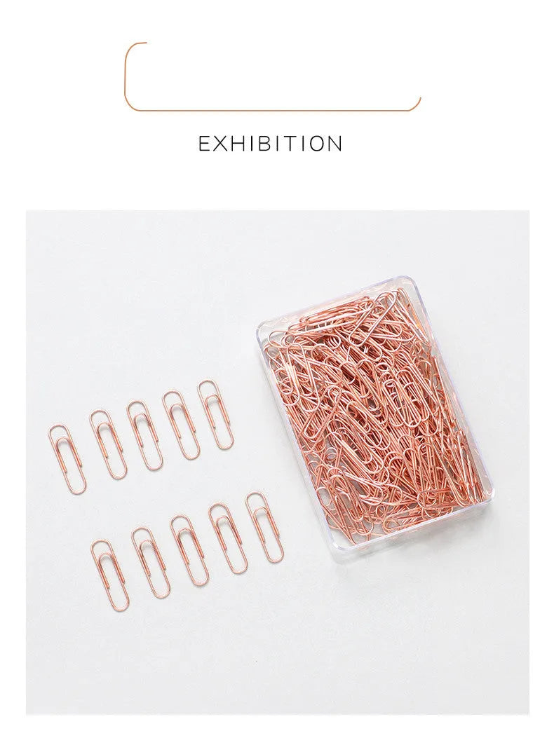 Rose gold heart-shaped paper clips with steel core construction measuring 28mm each