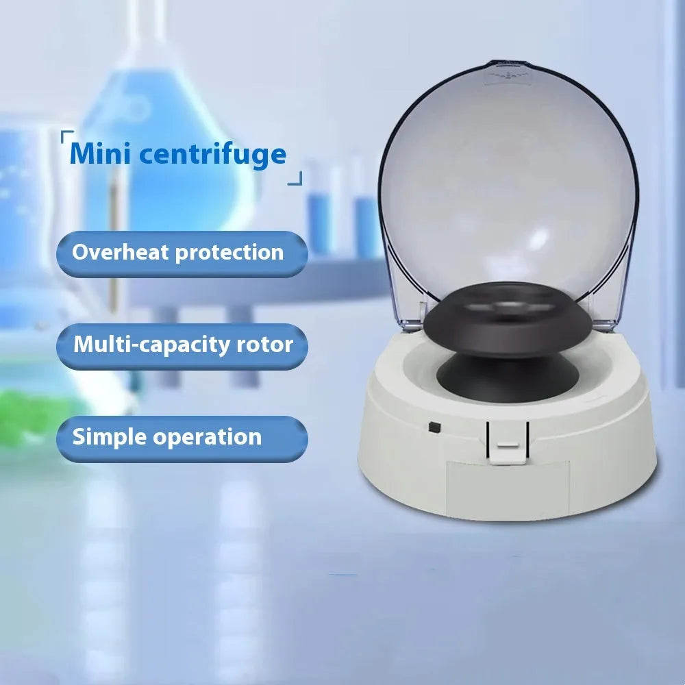 Small white mini laboratory centrifuge unit on a benchtop.