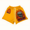 Yellow fashion shorts on a flat surface showing the multiple size options available
