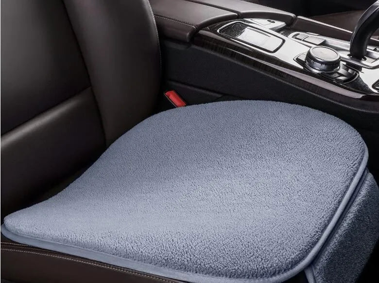 Fleece plush winter car seat cushion without backrest in black colour on a grey car seat