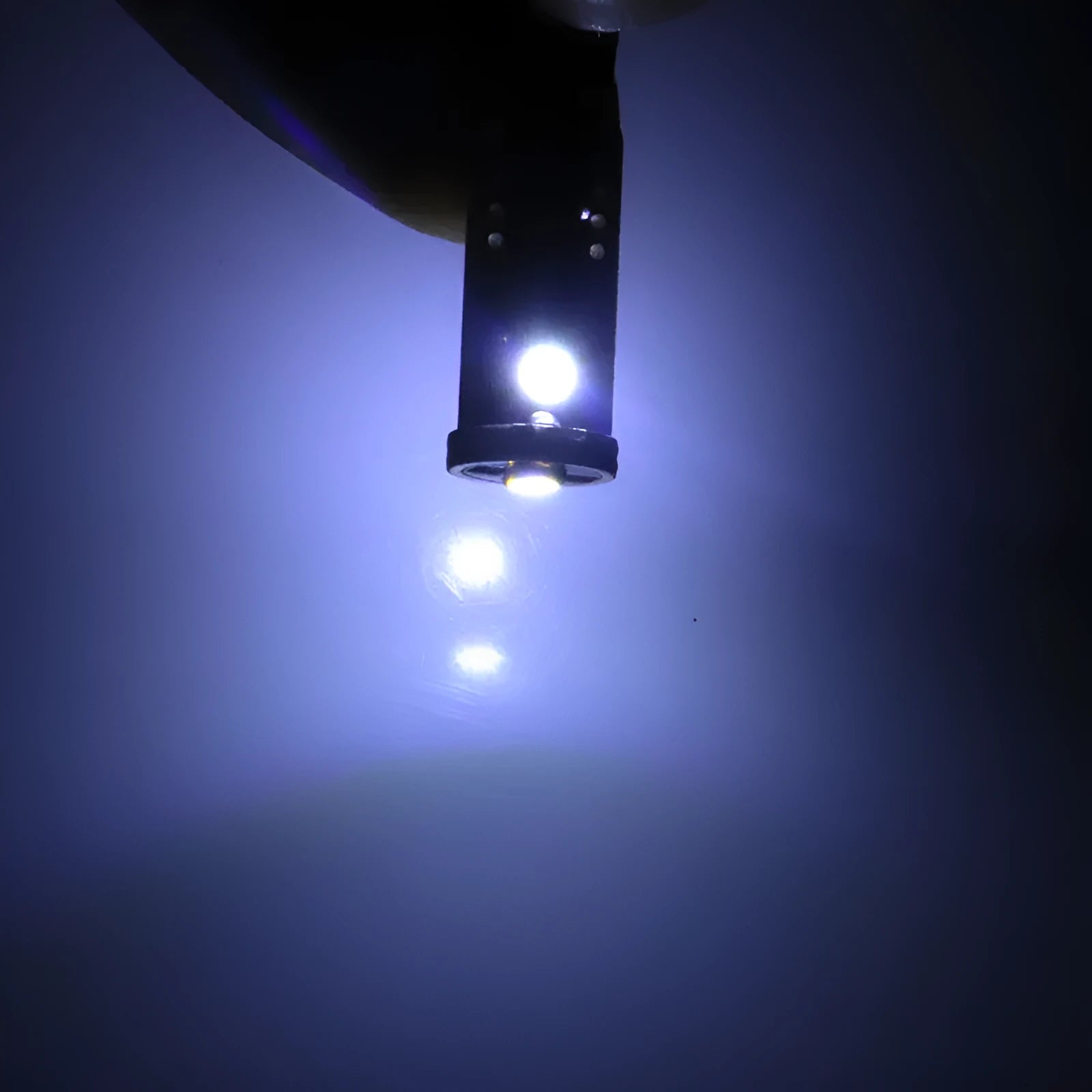 T10 W5W LED car light with blackboard white finish showing compact 23mm by 9mm dimensions