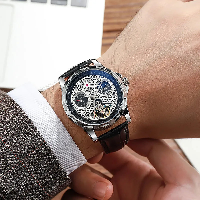 Men's automatic business watch with luminous hands on a steel bracelet, showing a black dial.