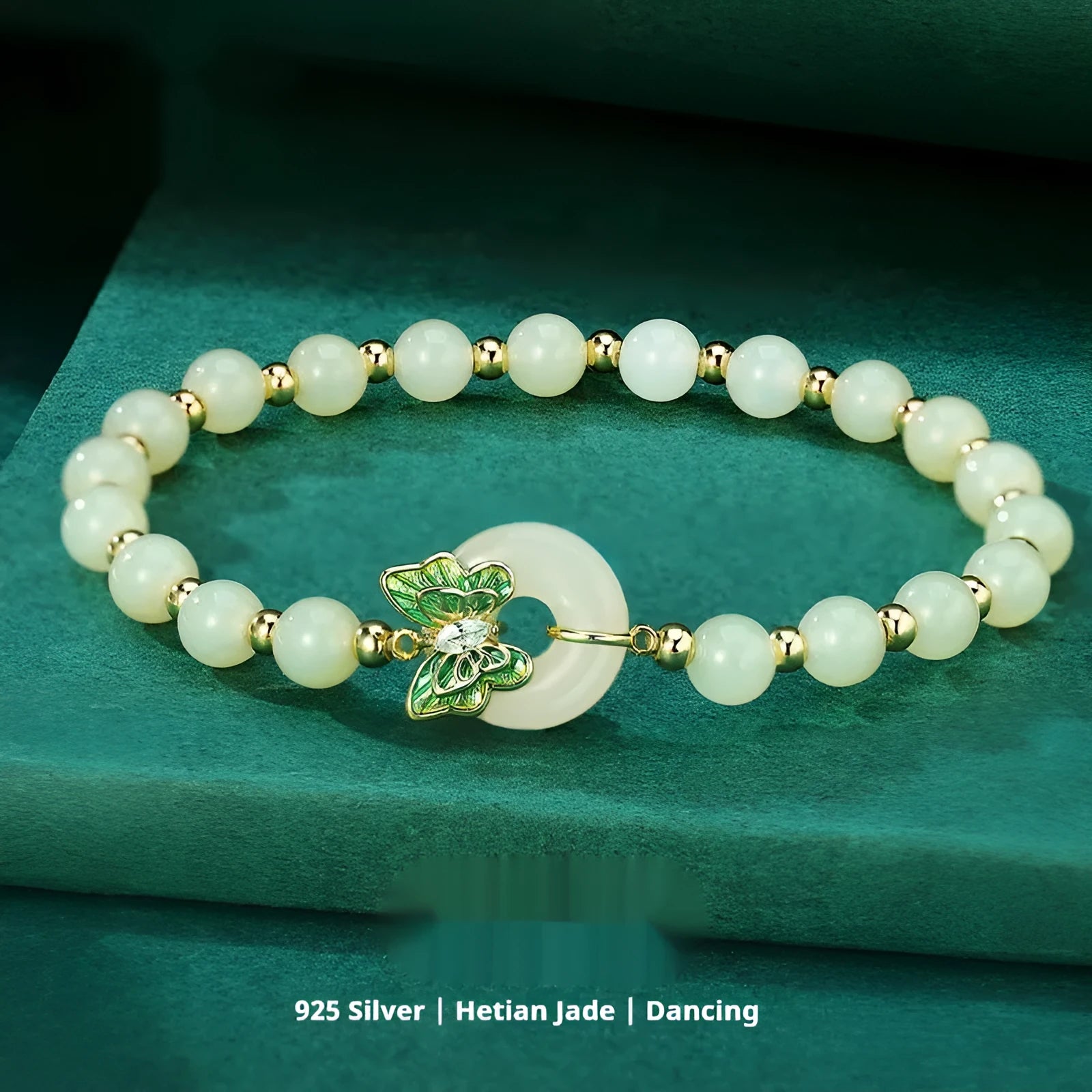 Cyan Hetian jade bracelet with a detailed sterling silver butterfly and gemstone ornament.