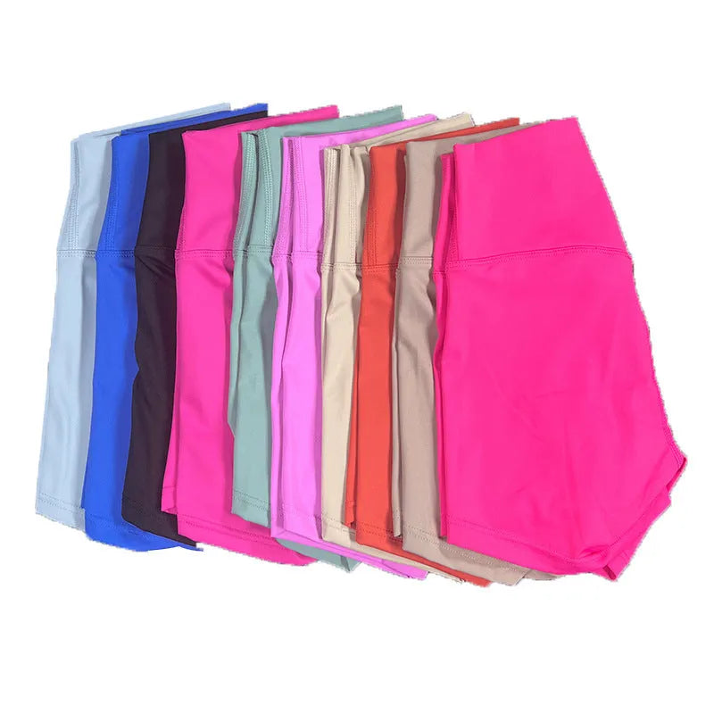 High-waisted women's yoga shorts in nylon fabric, shown in pink litchi colour.