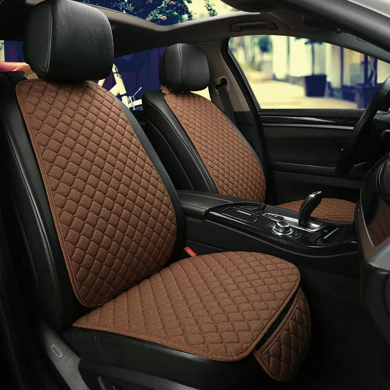 Linen car seat cushion showing colour options including warm cream, coffee and Lafite red variations