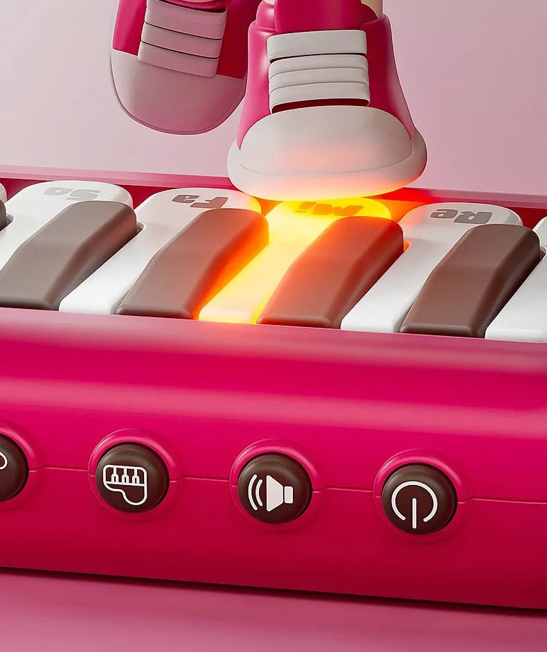 Pocket electronic keyboard toy for children in green or pink, plays little piano patterns for developmental training.