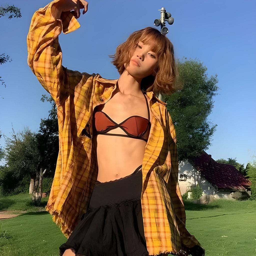 Dopamine yellow plaid shirt with a loose, cardigan-style fit on a hanger.