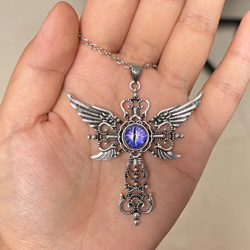 Geometric devil wings cross pendant necklace in alloy metal on a chain.