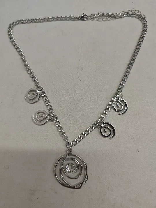 Spiral donut alloy jewellery set with necklace, bracelet, and earrings in gold or silver electroplated finish