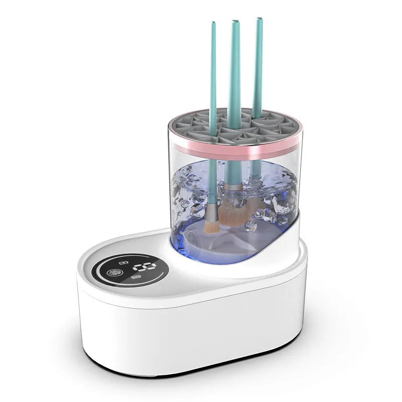 White rechargeable automatic makeup brush cleaner and dryer stand on a table