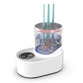 White rechargeable automatic makeup brush cleaner and dryer stand on a table