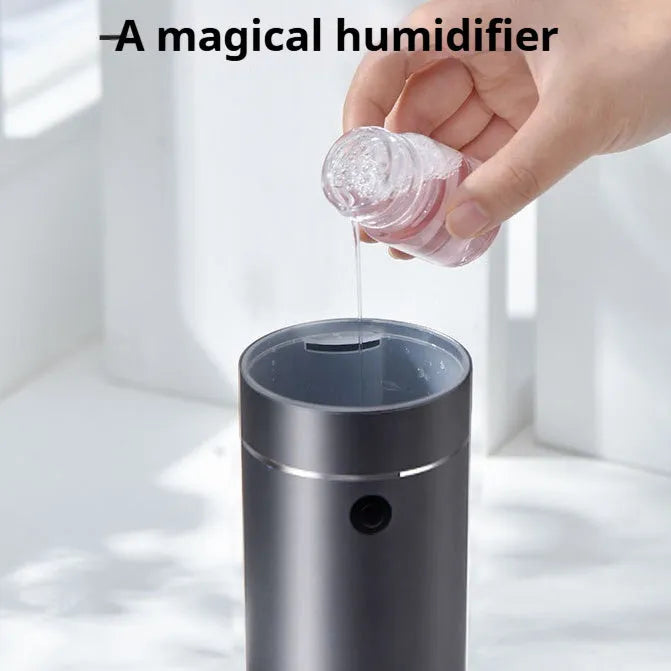 Dark gray column-shaped mini USB aromatherapy humidifier with 0.5-1L tank and single fog export.