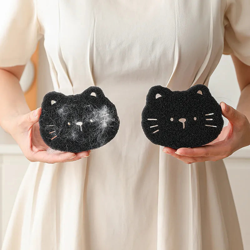 Two black bear-shaped sponge cleaning balls for pet hair removal in laundry