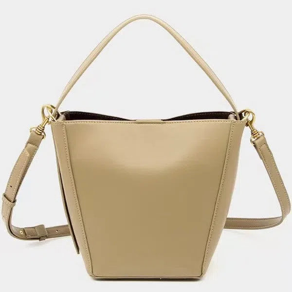 Urban minimalist bucket crossbody bag in army green with front three-dimensional pocket and adjustable strap