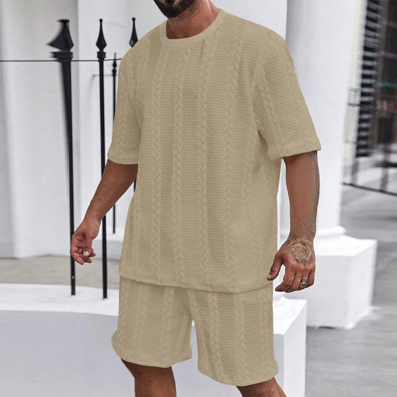 Men's knitted jacquard short sleeve pullover and shorts set in a solid colour on a hanger.