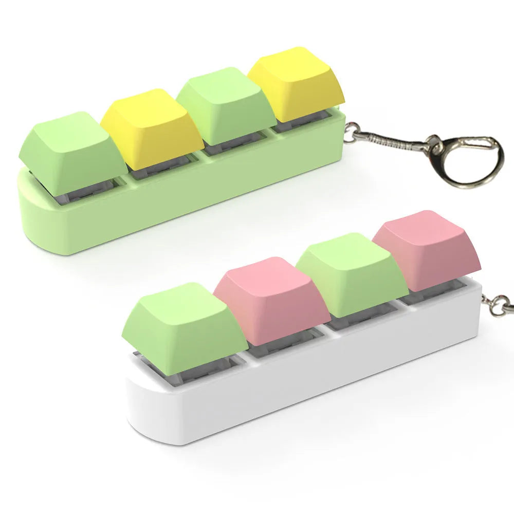 4-key mechanical keyboard switch tester in assorted colours on a desk