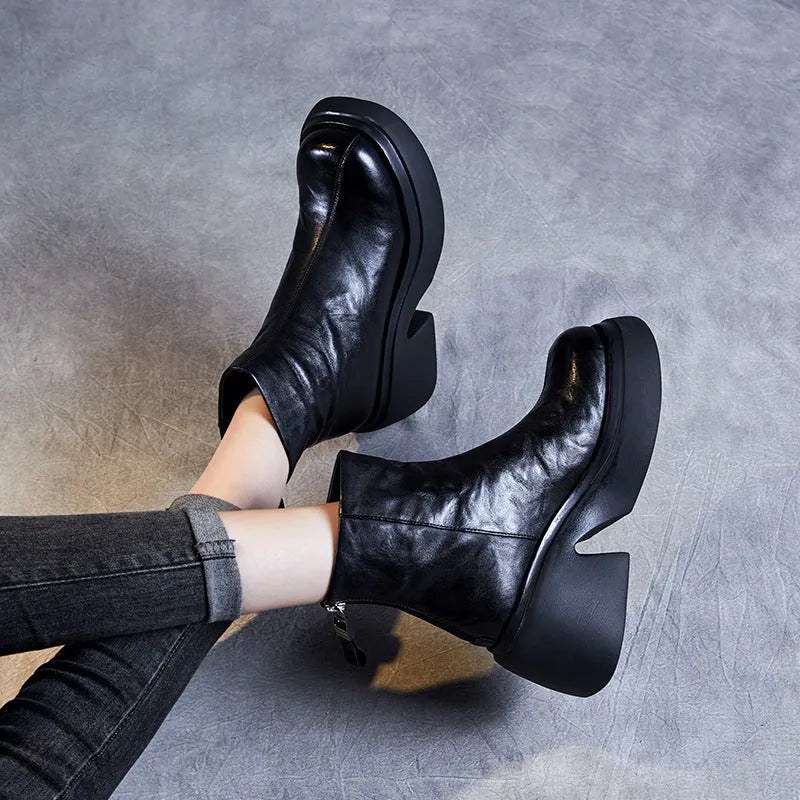 Women's chunky heel ankle boots in black with thick bottom, rubber outsole, and cotton cowhide upper