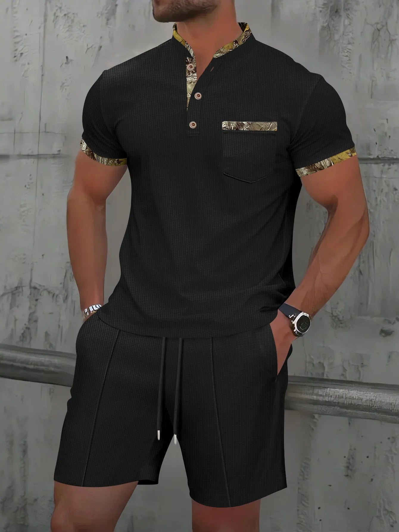Men's grey zip-front polo collar tracksuit top and shorts set laid flat.