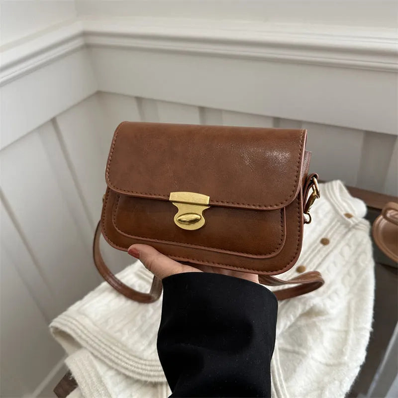 Soft PU leather retro small square handbag in black, brown, dark brown, or light brown.