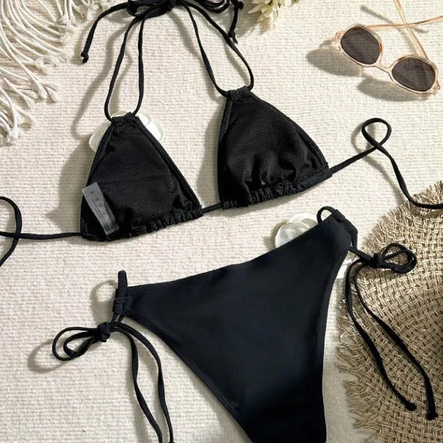 Black women's bikini set with 3D flower patterns, drawstring waist, and backless briefs design