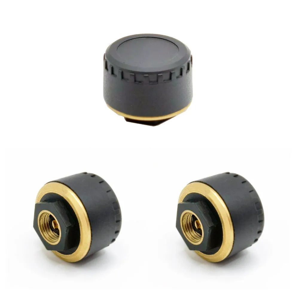 Four black Bluetooth tyre pressure sensors for car with mobile phone display showing pressure readings