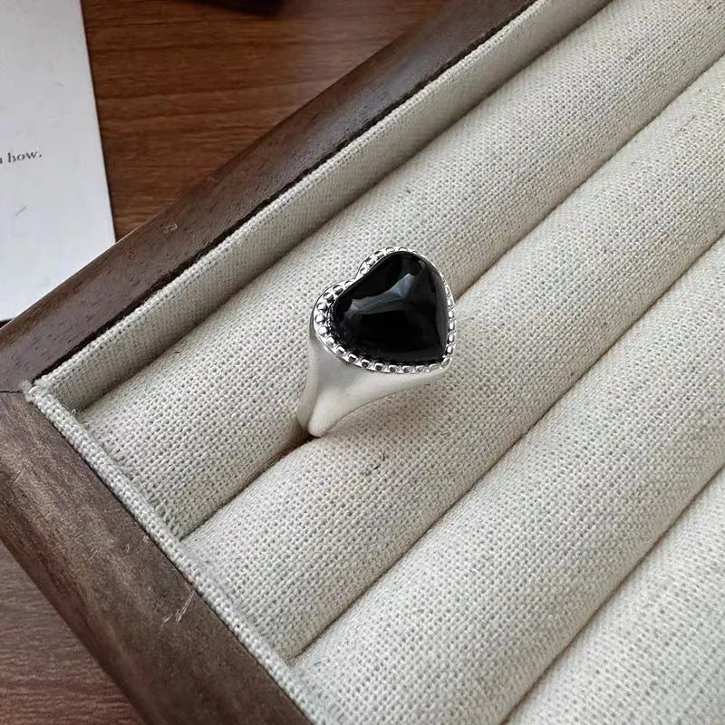 Adjustable open mouth ring with black agate stone and heart design in sterling silver