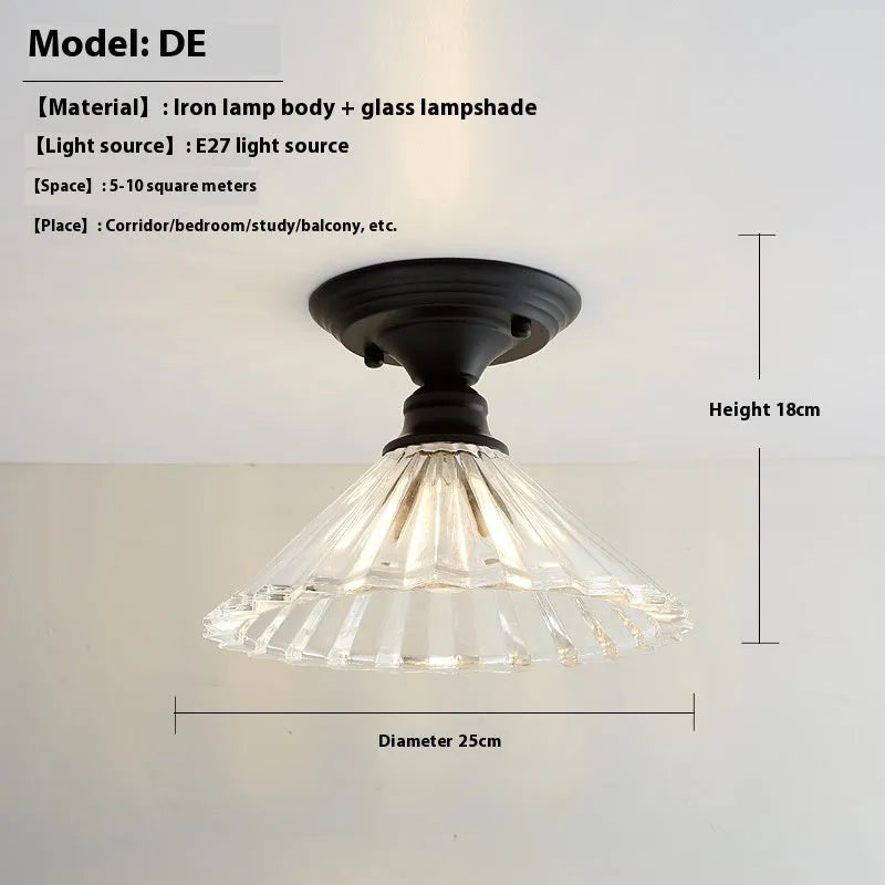 American retro single-head ceiling lamp with clear glass shade showing exposed filament style