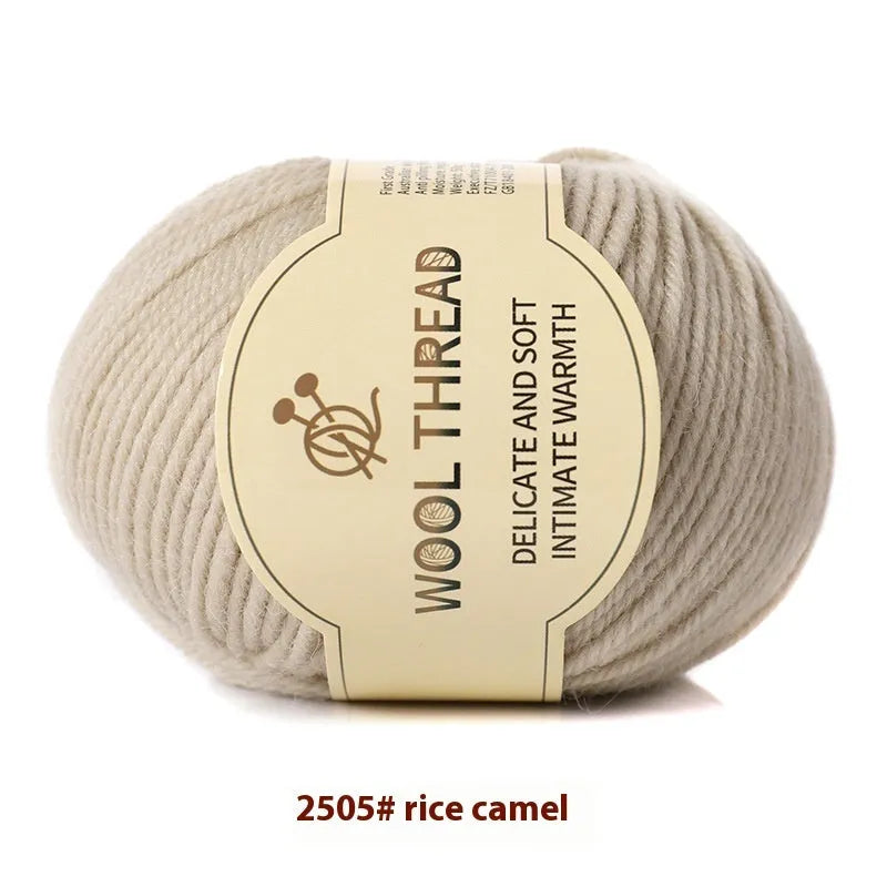 Roll of hand knitting wool yarn for baby clothes in assorted colours including green, beige, and red.