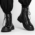 Men's black waterproof leather work boots with rubber sole and mid-top design