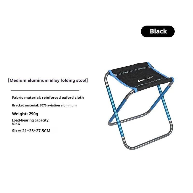 Black aluminium alloy folding camp stool in the open seating position.