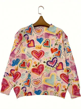 Loose fit digital printed top with lapel collar on a hanger, showing a graphic design.