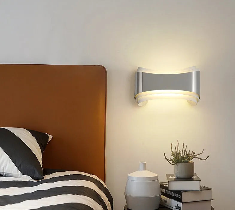Simple modern warm white LED wall lamp with matte finish and compact rectangular design.