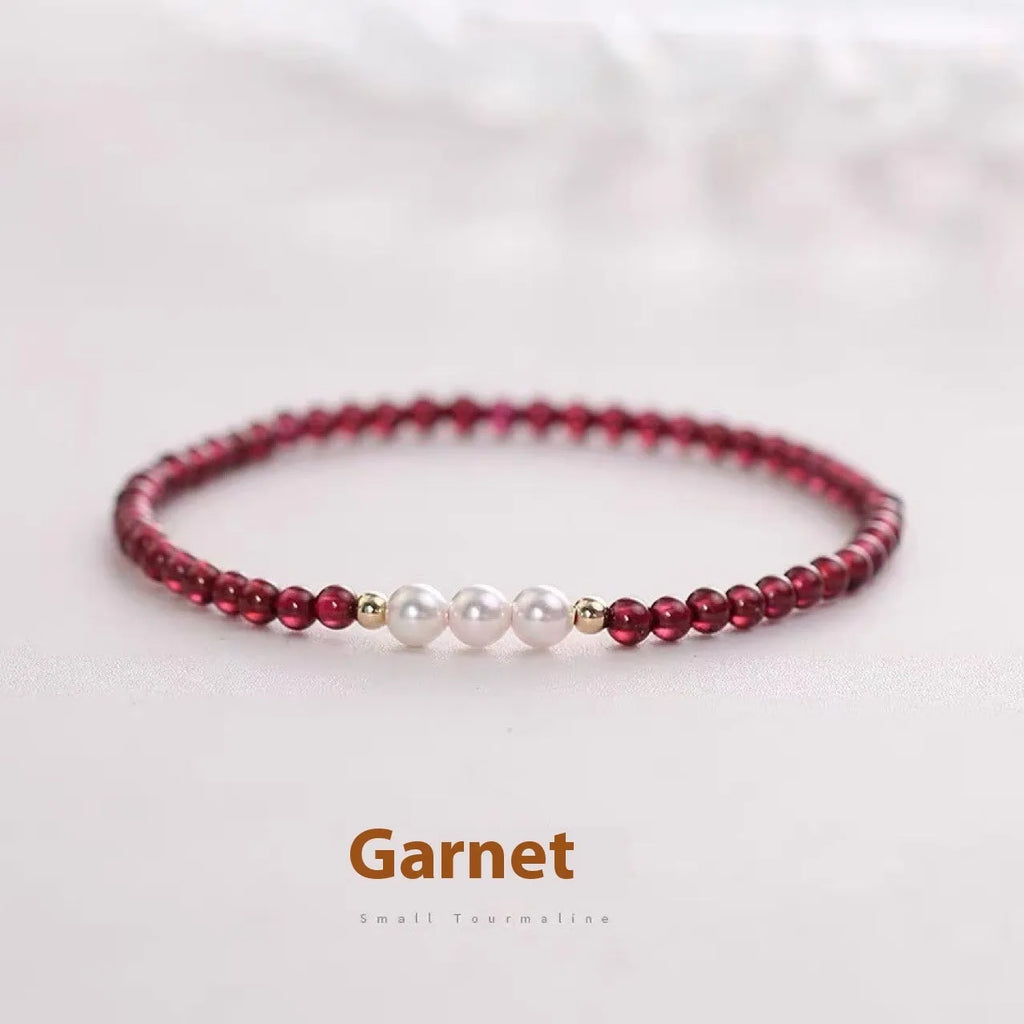Women's crystal bracelet with Chinese garnet beads and artificial pearls on wrist