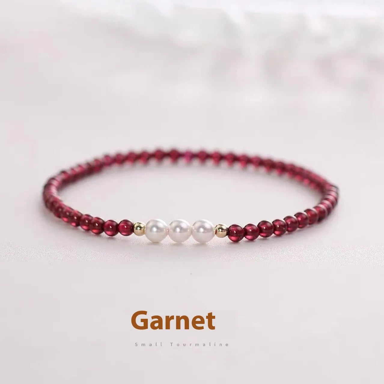 Women's crystal bracelet with Chinese garnet beads and artificial pearls on wrist